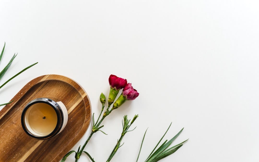 Trending candle vessels and scent ingredients flat lay